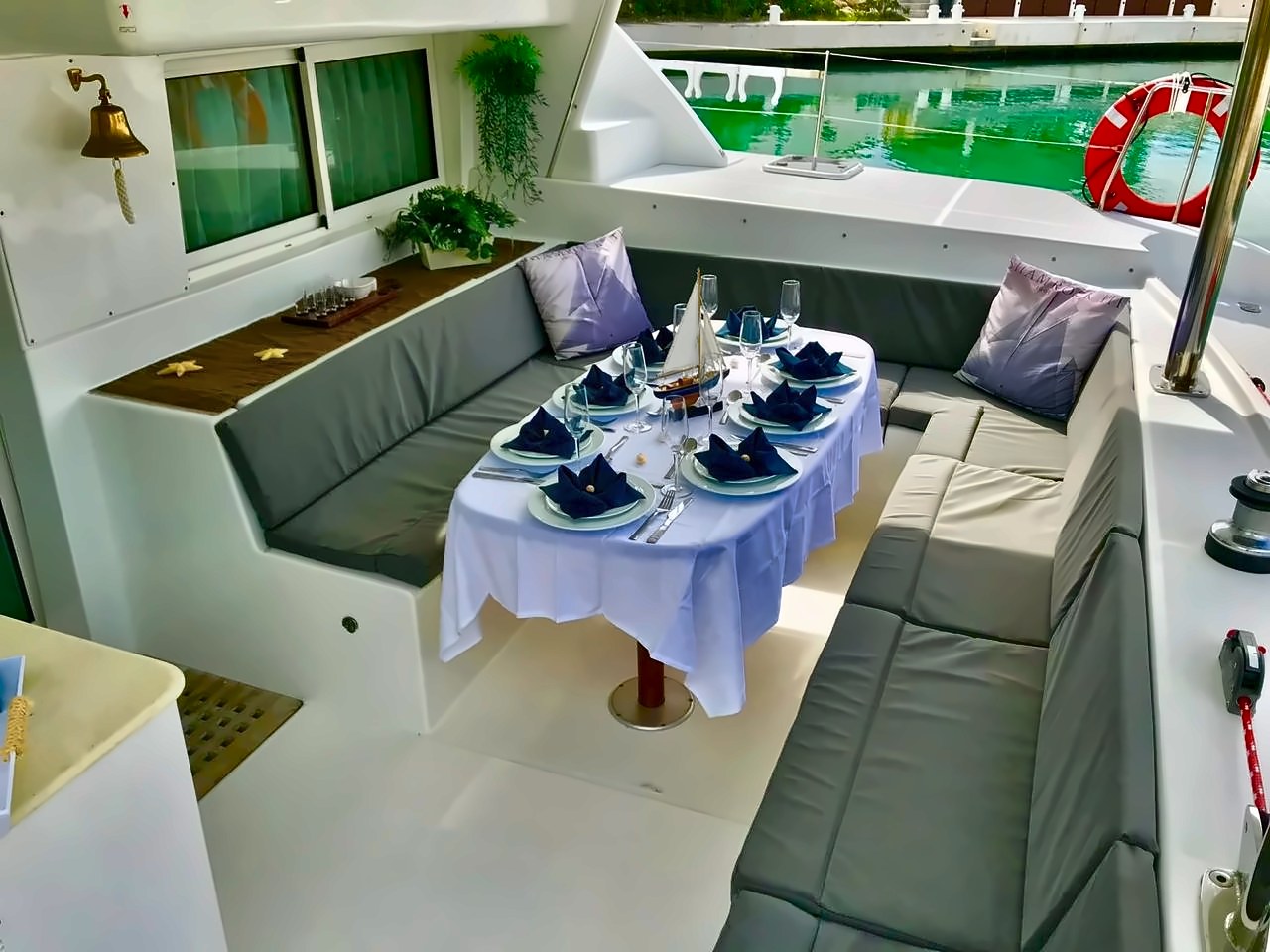 Dining table set on the deck of the 44 ft Lagoon Dralion sailing catamaran