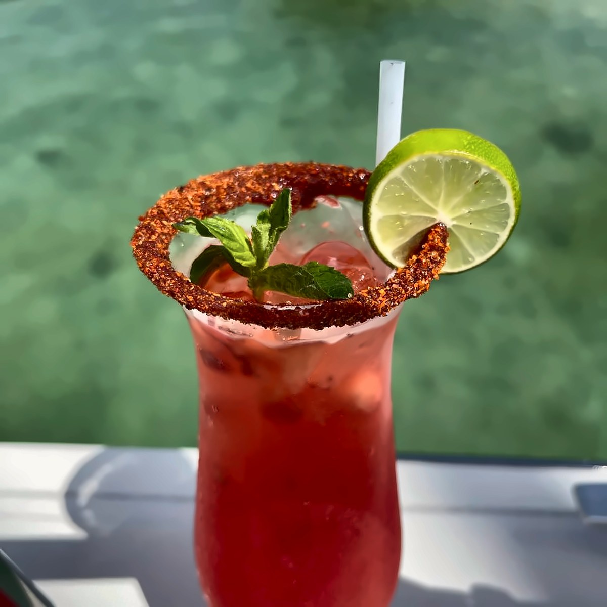 Signature cocktail with chili rim on a private yacht